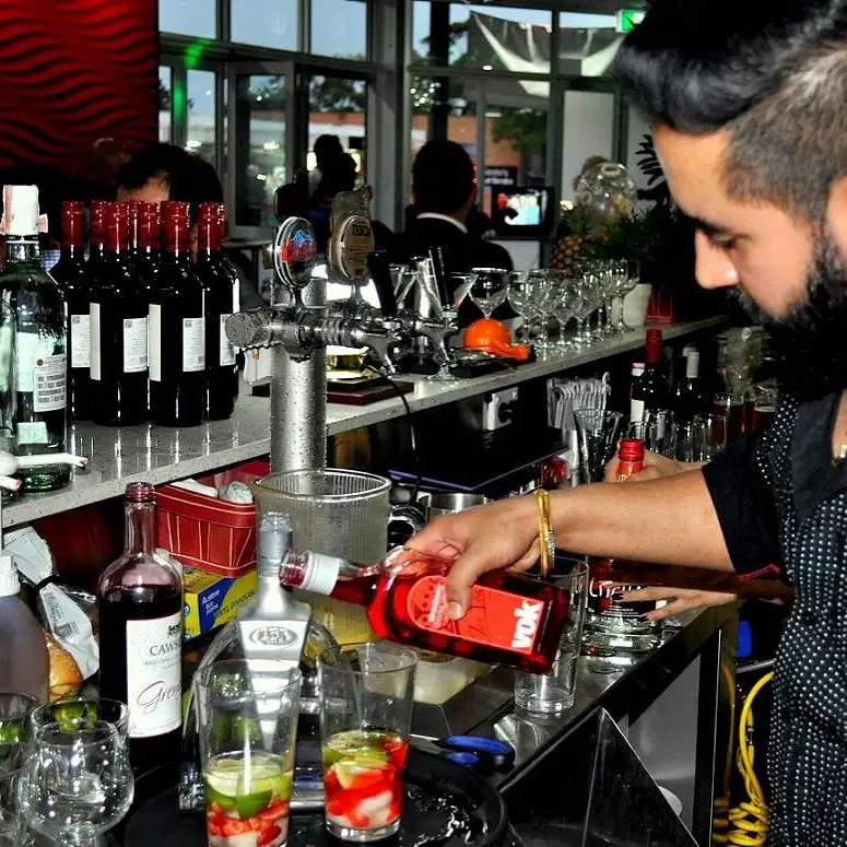 Bartender making cocktails at the 2Quench bar